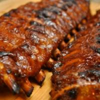 Enzo's Famous Pork Spare Ribs · Served with Southern beans, creamy cole slaw, and corn bread.