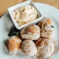 Zeppole · fried pizza dough dusted with cinnamon sugar, served with a side of cream cheese mousse
