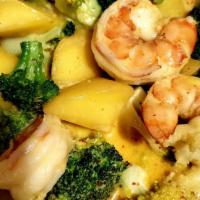 Mango Shrimp Curry Special · Pineapple, fresh mango, red pepper, broccoli, and yellow curry sauce.