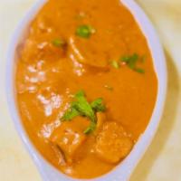 Chicken Tikka Masala · House favorite. Creamy tomato curry with chunks of boneless chicken.