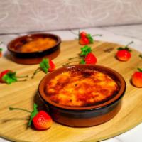 Creme Brulee · A rich velvety custard dessert with a layer of caramelized sugar torched to perfection in-ho...