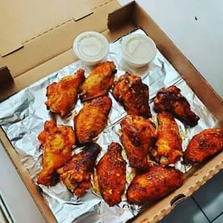 Classic Buffalo Wings · 6 jumbo wings double tossed in buffalo sauce and baked golden brown. Served with 1 side of ranch. Make it 12 jumbo wings with 2 sides of ranch for an additional charge.