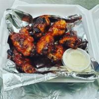 Smoky BBQ Wings · 6 jumbo bone-in wings baked until golden brown and coated in a smoky BBQ sauce.