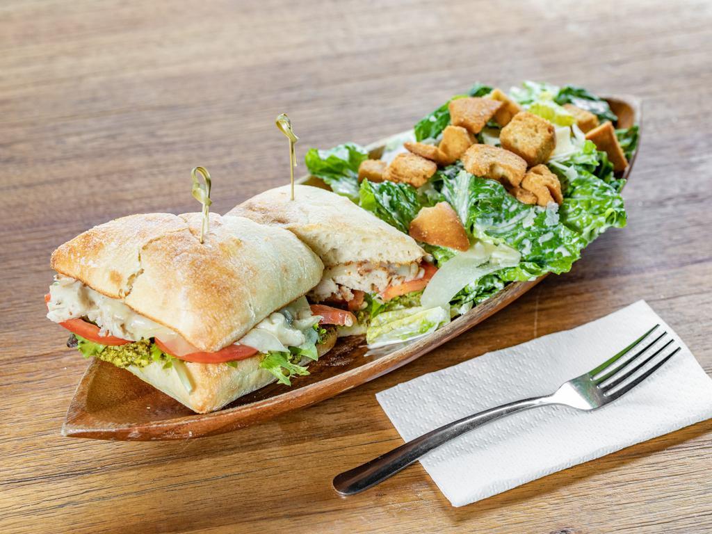Chicken Pesto Sandwich · Grilled chicken, smoked provolone cheese, pesto, tomato, side Caesar salad.