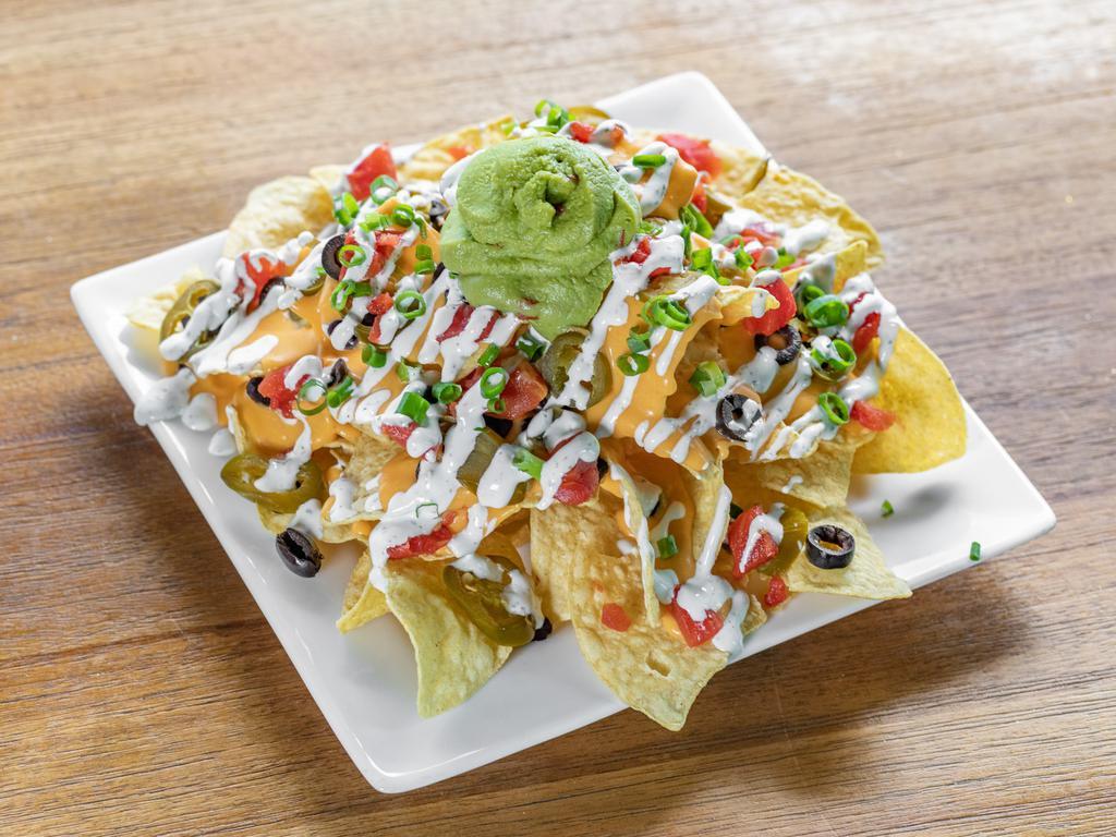The Works Nachos · Cheddar, black beans, tomatoes, green onions, guacamole, sour cream, black olives, jalapenos. Add Kalua pork or chicken for an additional charge.