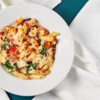 Chicken Bacon Alfredo · Penne pasta with creamy Alfredo sauce, roasted chicken, tomatoes, spinach, and bacon.