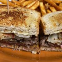 Patty Melt · Grilled rye bread, cheddar cheese, 1000 Island, hickory smoked bacon and sauteed onions.