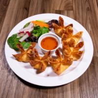 Crab Wonton · Crab meat mixed with celery and onions wrapped in a wonton and deep fried, served with our s...