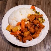 Honey Chicken · Breaded and fried chicken breast with pineapple chunks, carrot and sweet onion served with o...