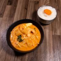 Kang Dang Curry · Shrimp served with coconut red curry, bamboo shoots, zucchini and pineapple chunks.