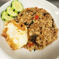 Ka paw ground CK fried rice  · Ground chicken sauteed with rice, basil sauce, onion, bell pepper, and basil. Fried egg on t...
