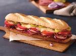 Italiano Sub · Ham, salami, provolone cheese, banana peppers, tomatoes,
red onions and sub dressing.