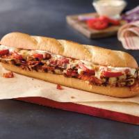Chicken Club Sub · Chicken breast strips, bacon, tomatoes, mayo and our three-cheese blend.