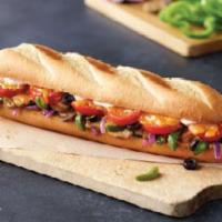 Veggie Fresco Sub · Mushrooms, green peppers, red onions, black olives, tomatoes, cheddar cheese and sub dressing.