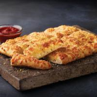 Cheesy Bread · Fresh baked bread strips with our three cheese blend and garlic butter served with a side of...