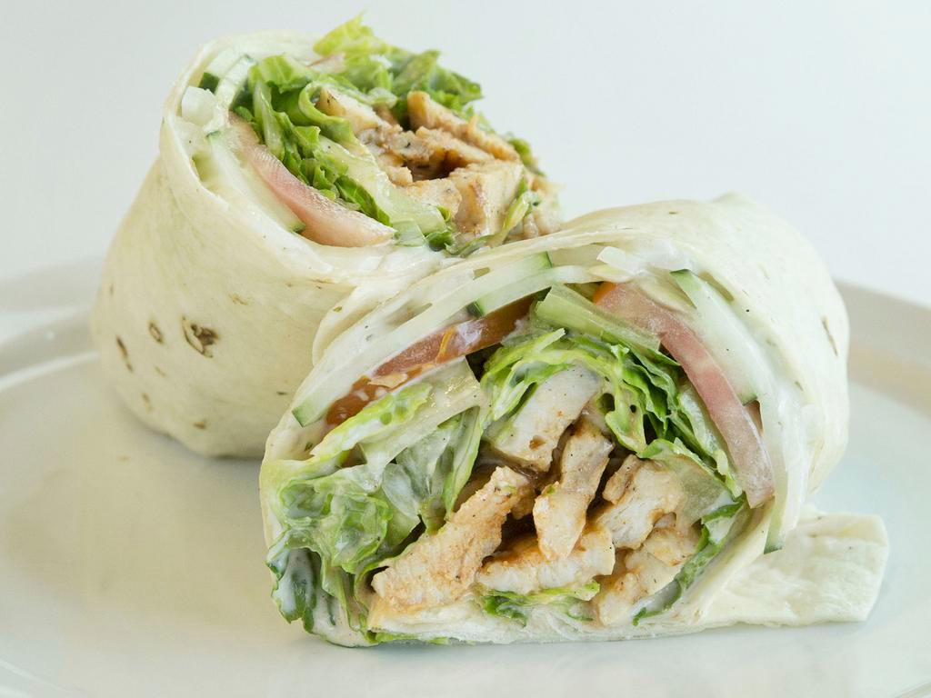 Chicken Caesar Wrap · Grilled chicken breast, bacon, romaine, tomato, cucumber and onion with Caesar dressing wrapped in a flour tortilla. Served with a homemade side.