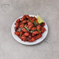 Chicken 65 · Boneless cubes of chicken marinated with Indian spices and deep fried.