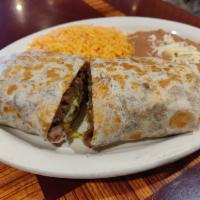 Steak Burrito Dinner · Served with rice and beans on the side.