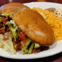 Torta Dinner · Served with rice and beans.