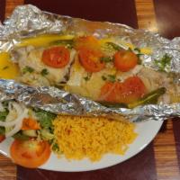 Pescado Enpapelado (Catfish Dinner) · Foil wrapped catfish oven steamed to perfection. Served with rice and side salad.
NOTE: Take...
