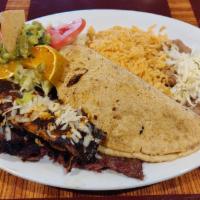 Bistek a La Tampiquena Dinner · Tender skirt steak, 1 cheese enchilada and 1 quesadilla with rice, beans, salad and tortillas.