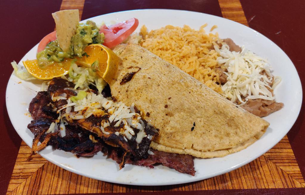 Bistek a La Tampiquena Dinner · Tender skirt steak, 1 cheese enchilada and 1 quesadilla with rice, beans, salad and tortillas.