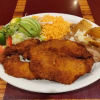 Milanesa Dinner · Breaded pork served with rice, beans, salad and tortillas.