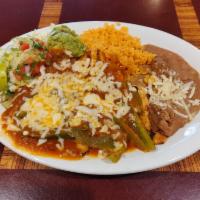 Chicken Breast Ranchera Suiza Dinner · Chicken breast with ranchero sauce and cheese. Served with rice, beans, salad and tortillas.
