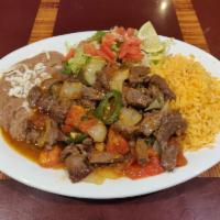 Skirt Steak a la Mexicana Dinner · Skirt steak with grilled onion, tomato and hot peppers. Served with rice, beans, salad and t...