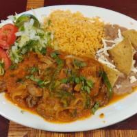 Steak Ranchero Dinner · Steak with tomato sauce. Served with rice, beans, salad and tortillas.