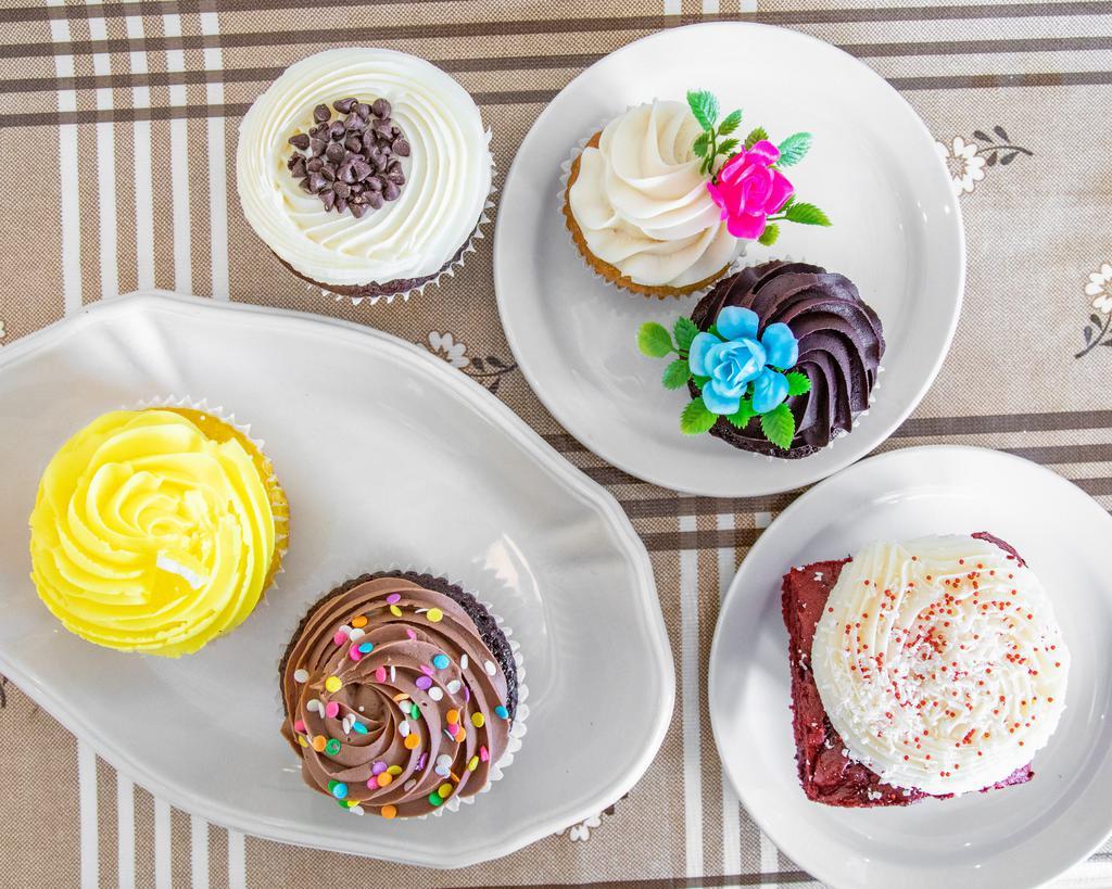 Suprise Baker's Choice Dozen · 12 of our GIANT sized cupcakes in a baker's choice assortment. Our jumbo cupcake is 2 times the standard cupcake size!