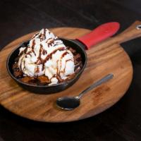 Pizookie · Baked deep-dish chocolate chip cookie served with vanilla ice cream, whipped cream, and choi...