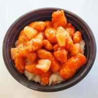 Crispy Sweet and Sour Chicken Rice Bowl · White rice with sweet and sour chicken.