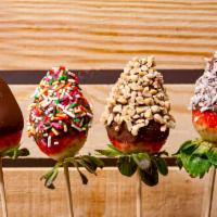 Strawberry Dippers · Strawberry dipped in chocolate and topping of your choice: plain, coconut, peanuts, or sprin...
