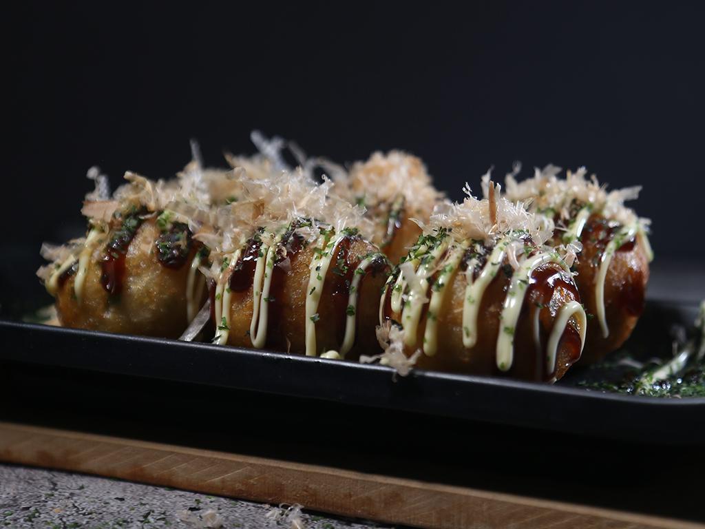 Takoyaki Octopus Balls (6pcs) 章鱼烧 · Batter made from octopus and shapped into a ball. 