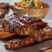 BBQ Ribs · Grilled pork ribs to perfection with BBQ sauce.