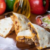 Quesadillas Supremas · Served with lettuce, pico de gallo and sour cream / Servida con lechuga, pico de gallo y cre...