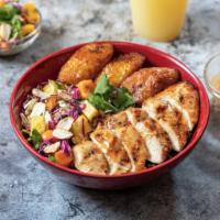 Tropical Bowl · served with grilled chicken, moro rice, sweet plantains, tropical salad and almond.