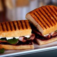Cranberry Turkey Panini · Smoked turkey breast, baby spinach, cream cheese and cranberry sauce.