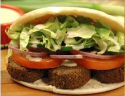 Falafel Sandwich · Chickpea patties in a pita pocket with tomatoes, lettuce, onions, cucumber and tahini sauce....
