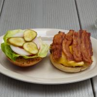 Bacon Royale Burger · Lettuce, tomato, onion, pickle and bacon. Choice of cheddar, American and bleu cheese.