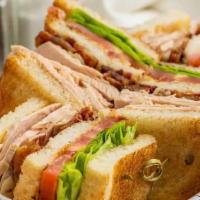 Turkey Club · Oven roasted turkey, bacon, lettuce, tomato and mayo.