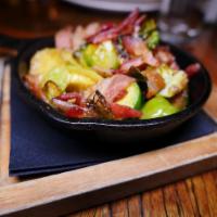 Brussel Sprouts with Bacon · Tossed In Olive Oil and House Blend Spices Roasted and Topped With Crispy Smoked Bacon.