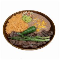 Carne Asada · Premium skirt steak, flame broiled to customers preference. Served with rice, beans, pico de...