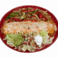 Burrito Fajita De Camarones · Flour tortilla filled with rice, beans and large shrimp that is sauteed in butter with garli...