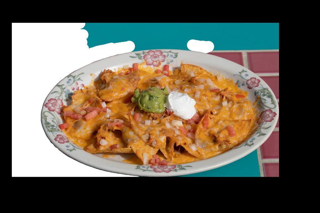 Super Nachos · Chips, beans and cheddar cheese melted with your choice of chicken or ground beef. Topped with tomatoes, onions, sour cream and guacamole.