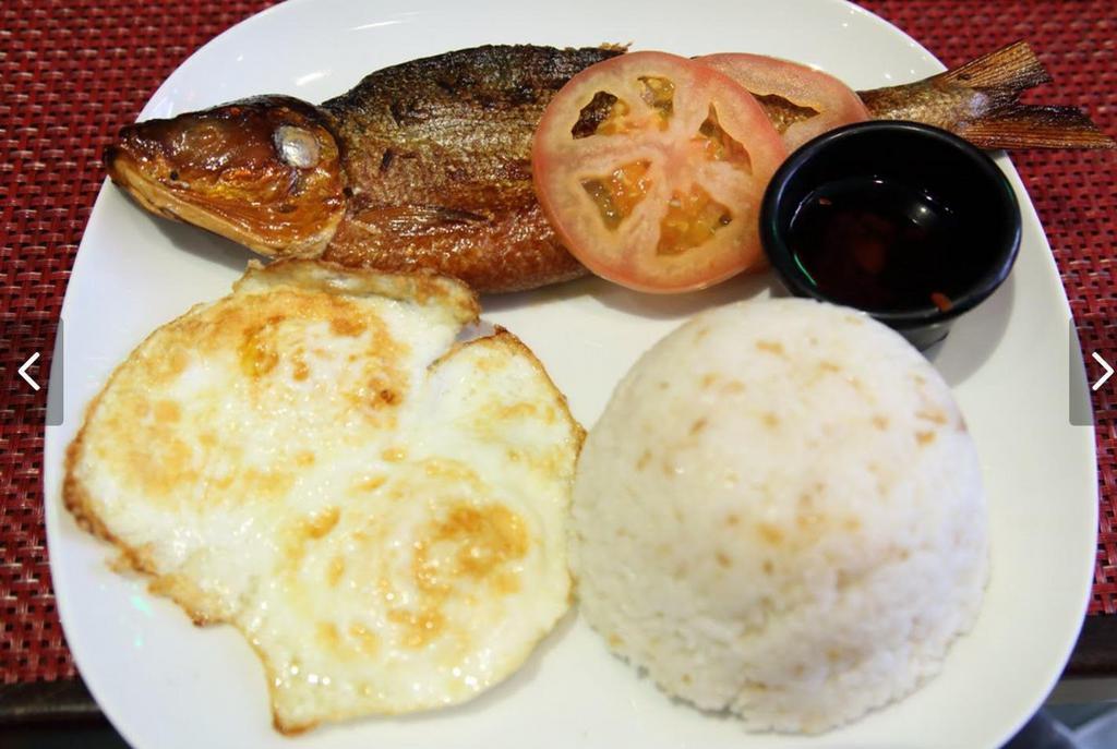 Tinapasilog  · Smoked fish, garlic rice, and eggs.