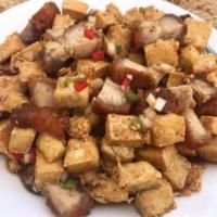 Tokwa't Baboy · Deep-fried tofu, braised pork ear, soy sauce, and onion.