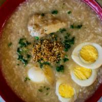 Arroz Caldo · Hot porridge, chicken, ginger, scallion and crispy garlic.