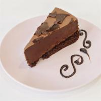 Chocolate Mousse Cake · Chocolate mousse with a layer of chocolate cake topped with chocolate shavings